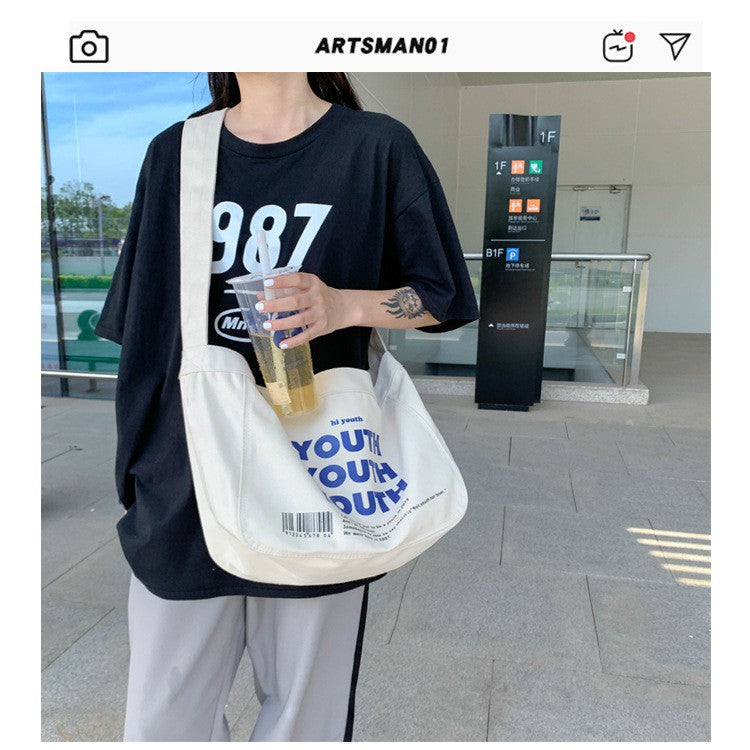 GUCSELECTED(B1775) กระเป๋าผ้าสะพายข้าง YOUTH ผ้าแคนวาส ผู้ชาย ผู้หญิง ใบใหญ่มี2สี